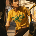 Person wearing a yellow 'Brasil' t-shirt stepping out of a vehicle.