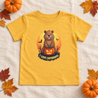 AI-created flat lay: Heather Yellow Gold I Love Capybaras Halloween toddler tee with autumn styling.
