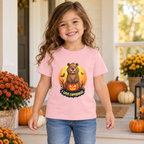 AI-created lifestyle mockup: child wearing the Pink I Love Capybaras Halloween toddler tee on an autumn porch.